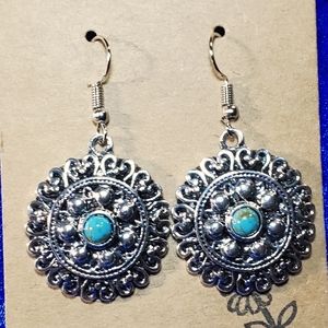 Silver Medallions with Turquoise in the center. Hook and dangle.